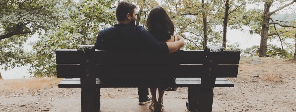 A couple sitting on a bench